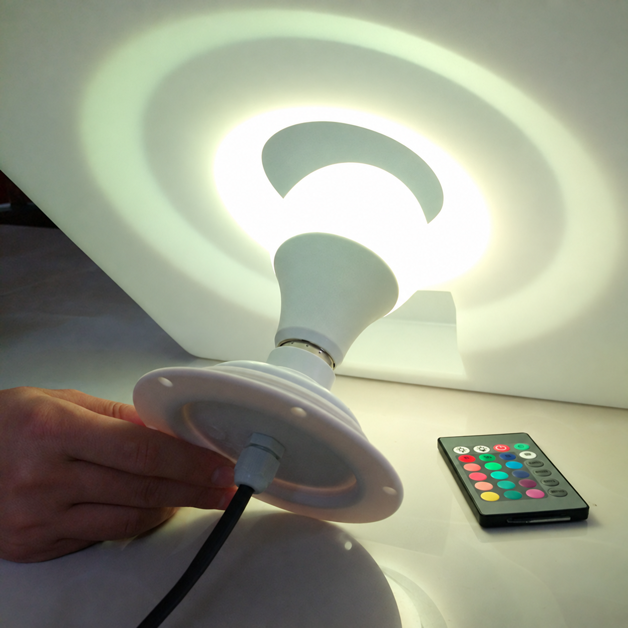 Wired E27 bulb and round base illuminating a translucent PE furniture shell from inside
