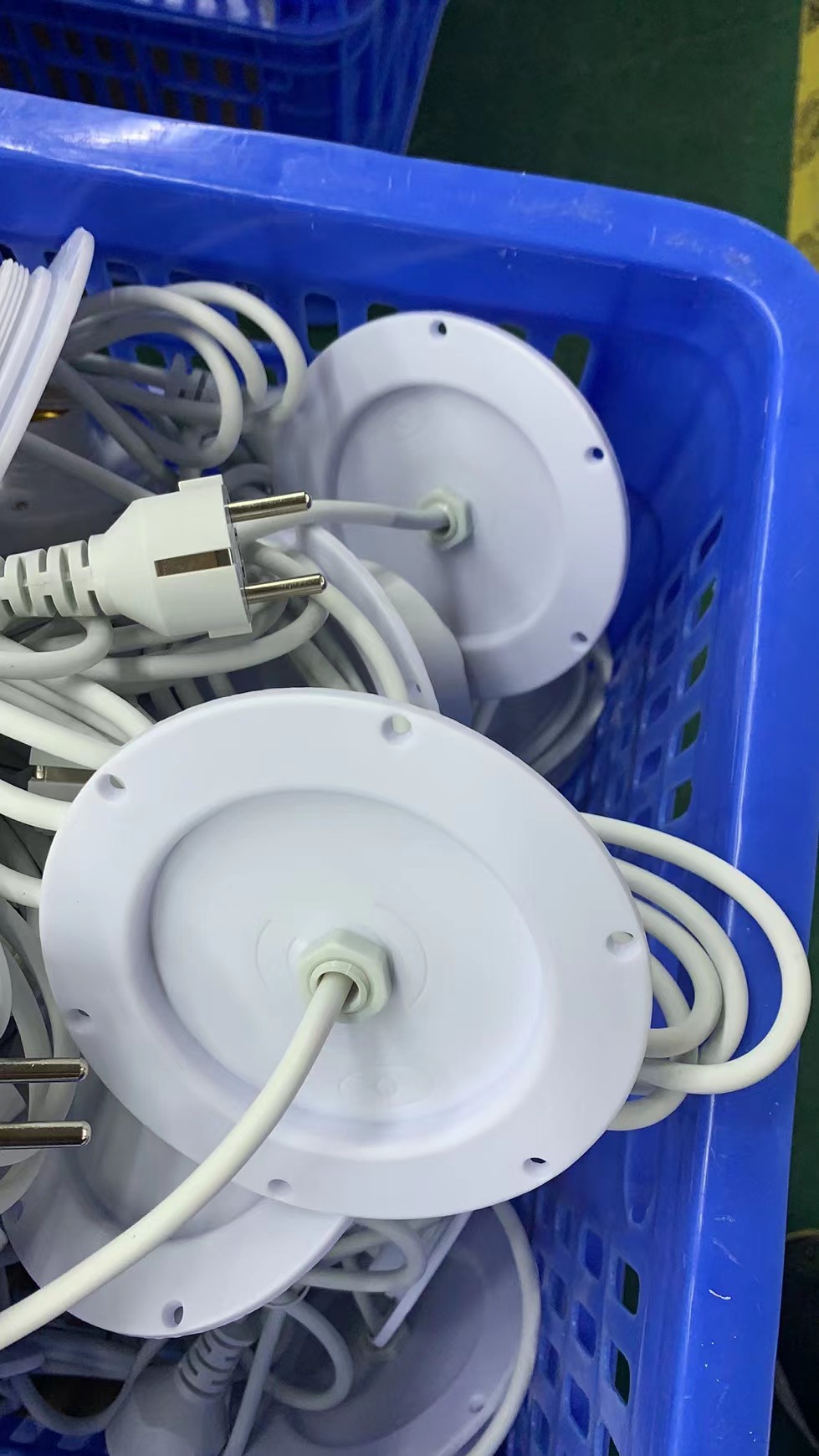 Production batch of white wired E27 light bases for PE illuminated furniture
