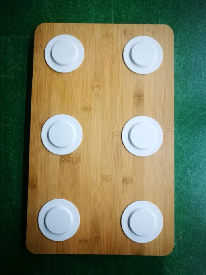Wooden board with six circular induction charging plates in two columns