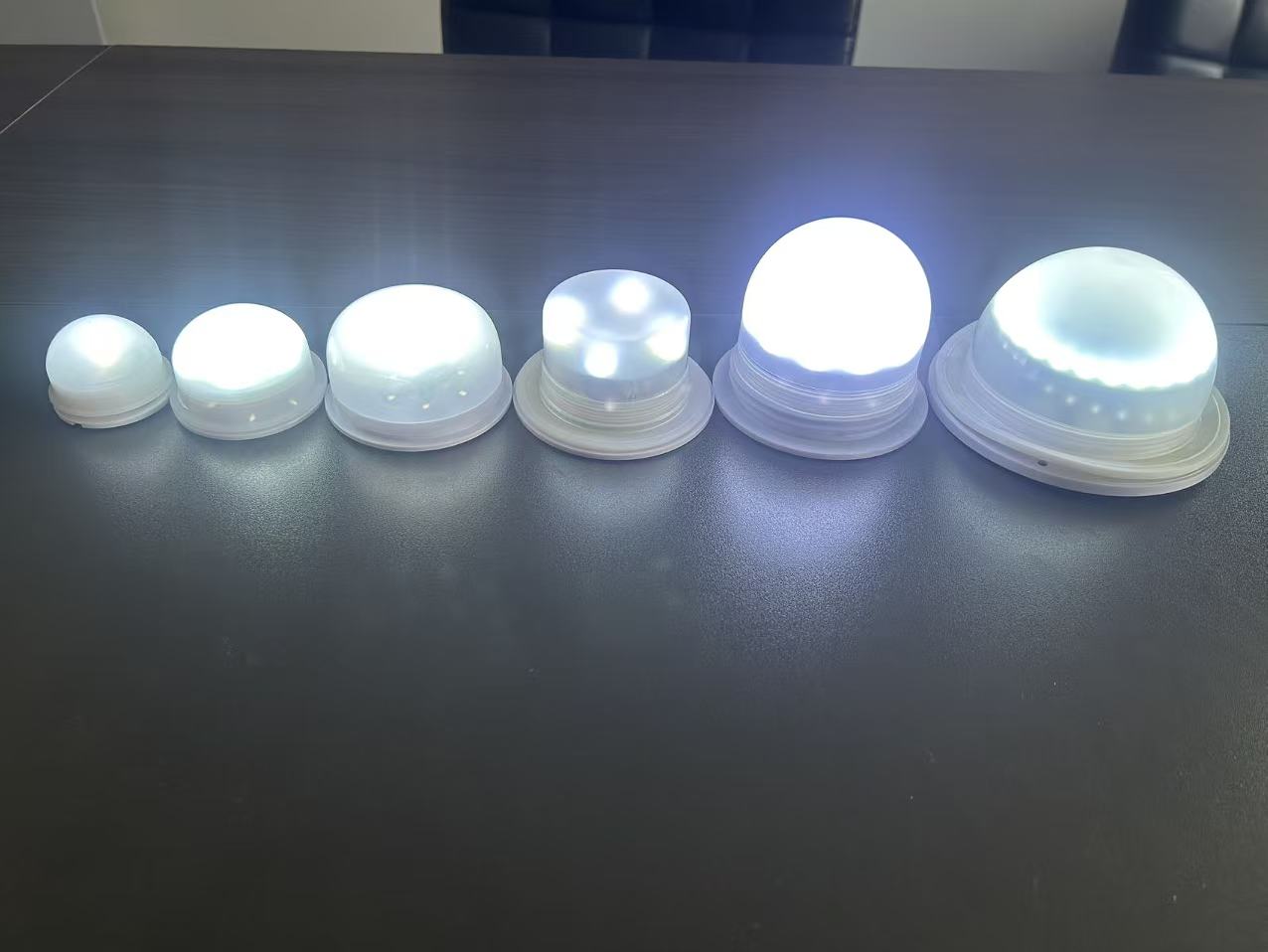 Six illuminated rechargeable LED modules in different diameters and diffuser shapes