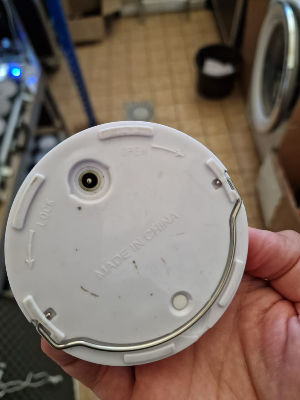 Customer's previously purchased VC-SP120 underside with a DC charging socket and OPEN and LOCK markings