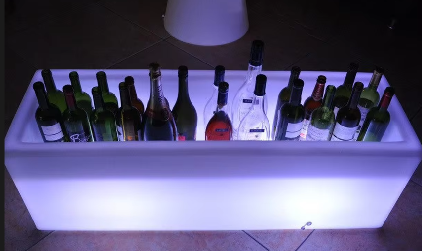 Large illuminated ice bucket with a charging port accessible from the side
