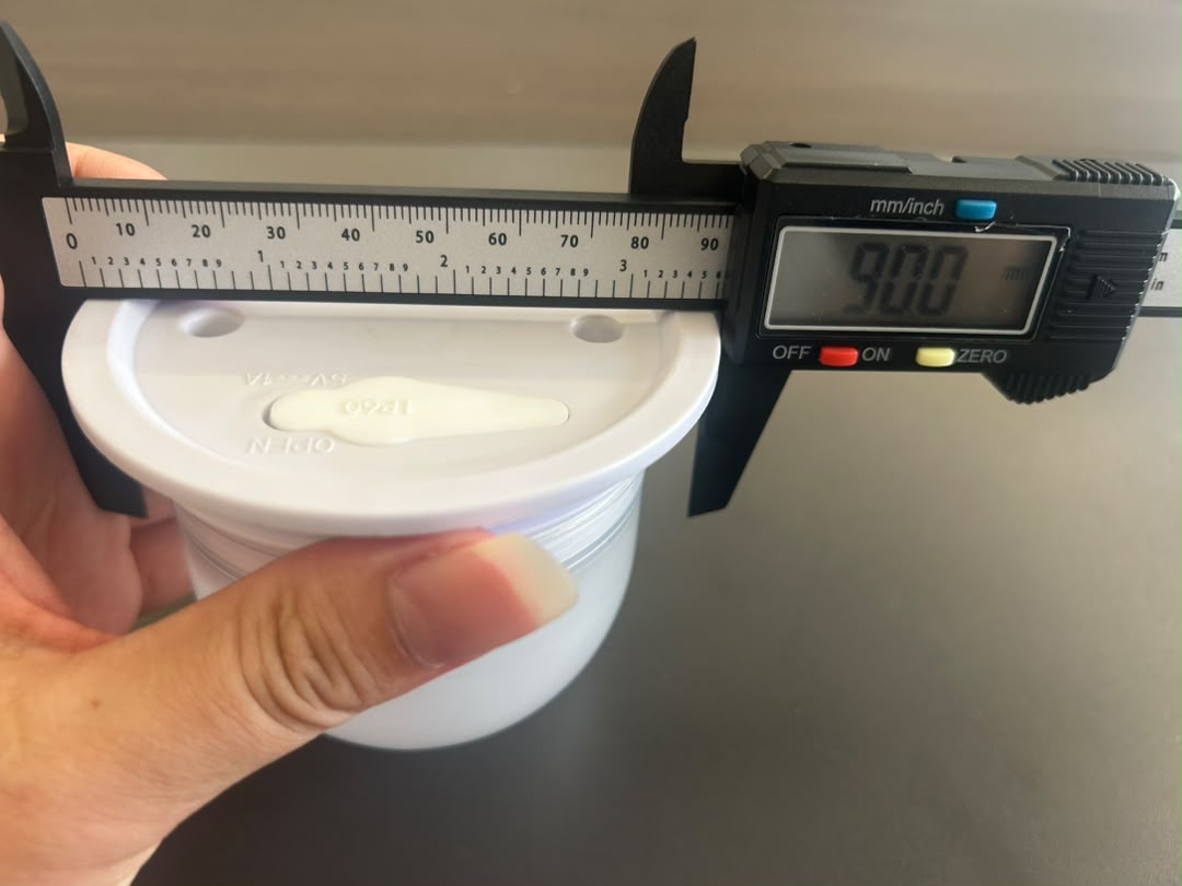 Caliper measuring VC-LS90 sample overall base diameter at 90.0 mm